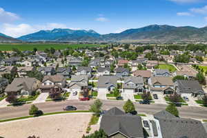 Aerial view of residential area featuring a mountain backdrop