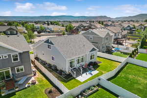 Aerial perspective of suburban area with a mountain backdrop