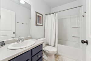 Full bathroom with vanity and shower / bath combination with curtain