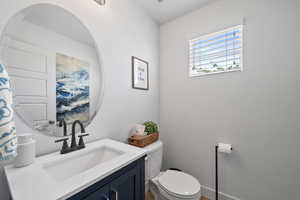 Bathroom featuring toilet and vanity