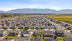 Aerial view of residential area featuring a mountainous background