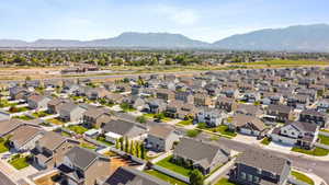 Aerial perspective of suburban area with a mountain backdrop