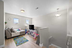 Living room featuring wood finished floors and baseboards