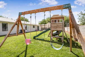 View of play area featuring a fenced backyard