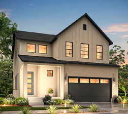 View of front of home with brick siding, a garage, driveway, roof with shingles, and board and batten siding