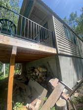 View of side of home with log veneer siding