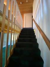 Staircase with wood ceiling