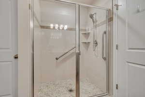 Bathroom featuring a shower stall