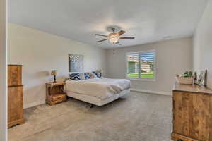 Bedroom featuring carpet floors and a ceiling fan