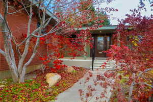 Doorway to property with brick siding