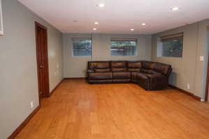 Family room featuring light wood-style floors and recessed lighting