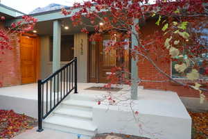 View of exterior entry featuring a porch