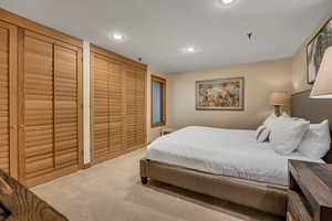 Carpeted bedroom featuring recessed lighting