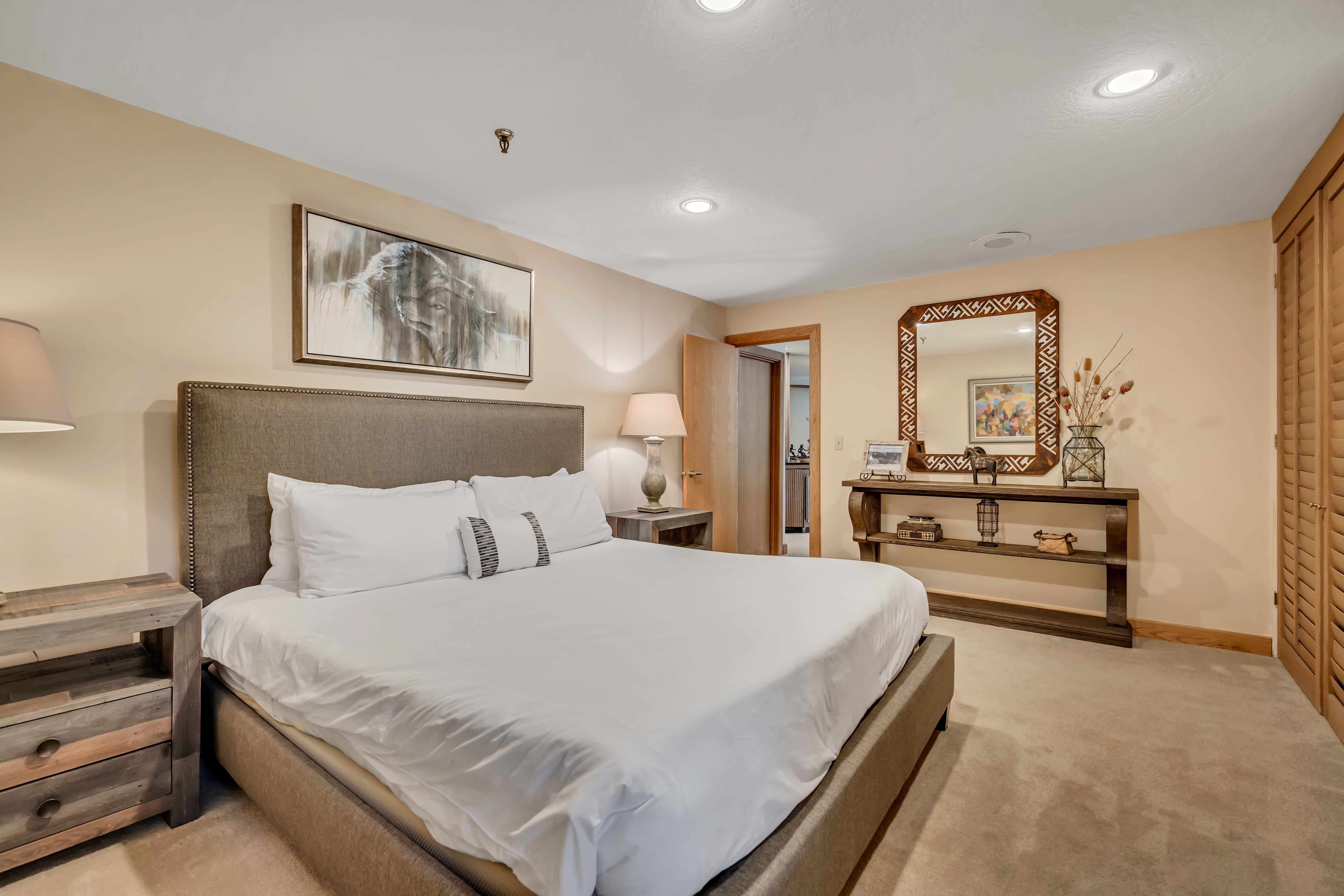 Bedroom with light carpet and recessed lighting