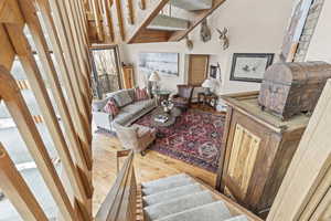 Living room with wood finished floors and stairs