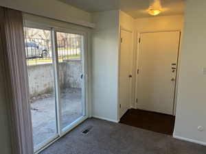 Entryway featuring carpet flooring