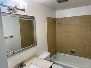 Bathroom featuring washtub / shower combination and vanity