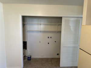 Laundry area featuring washer hookup, tile patterned floors, and gas dryer hookup