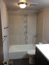 Full bath with vanity and tub / shower combination