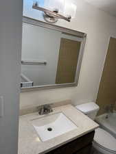Bathroom with vanity and  shower combination