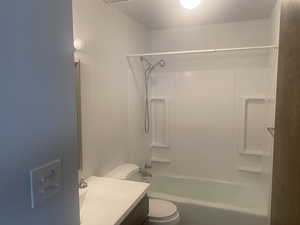 Bathroom featuring vanity and shower / washtub combination
