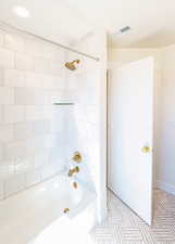 Full bathroom featuring washtub / shower combination