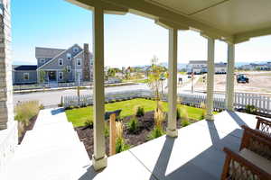 Covered porch with a residential view