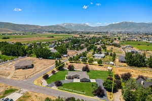 Aerial overview of property's location featuring a mountain backdrop and property parcel outlined