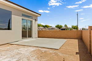 Fenced backyard with a patio area