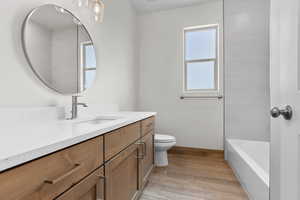 Bathroom with vanity and wood finished floors
