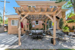 View of patio / terrace with outdoor dining area and a pergola