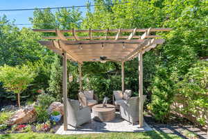 View of patio / terrace with ceiling fan and a pergola