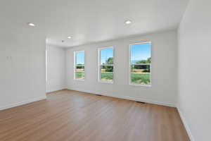 Unfurnished room featuring light wood finished floors and recessed lighting