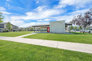 View of home's community featuring a residential view and a yard