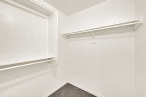 Spacious closet with carpet floors
