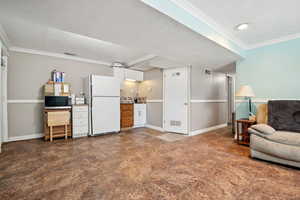 Living area featuring crown molding