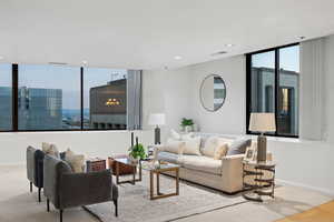 Living area featuring a city view and recessed lighting