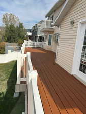 Wooden terrace featuring a residential view