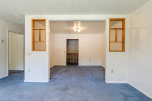 Spare room featuring carpet flooring