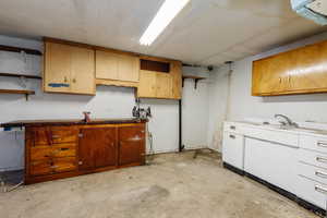 Kitchen with concrete flooring and open shelves