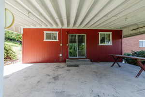 Doorway to property featuring a patio