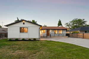 View of front of home with a porch and brick siding