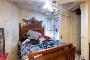 Primary Bedroom with a ceiling fan and sunroof