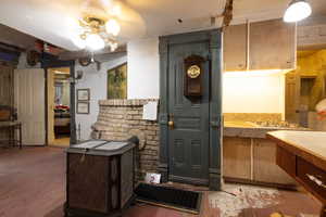 Interior space featuring light wood flooring and gas stovetop