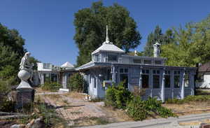 View of front of house featuring a sunroom