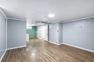 Basement featuring wood finished floors