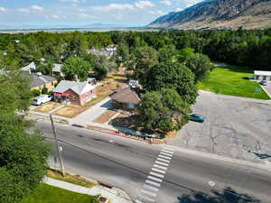 Drone / aerial view of a mountain backdrop and a heavily wooded area