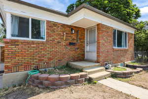 View of front facade featuring brick siding