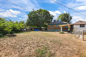 View of yard with a fire pit and a patio area