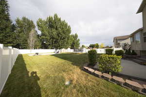 View of fenced backyard